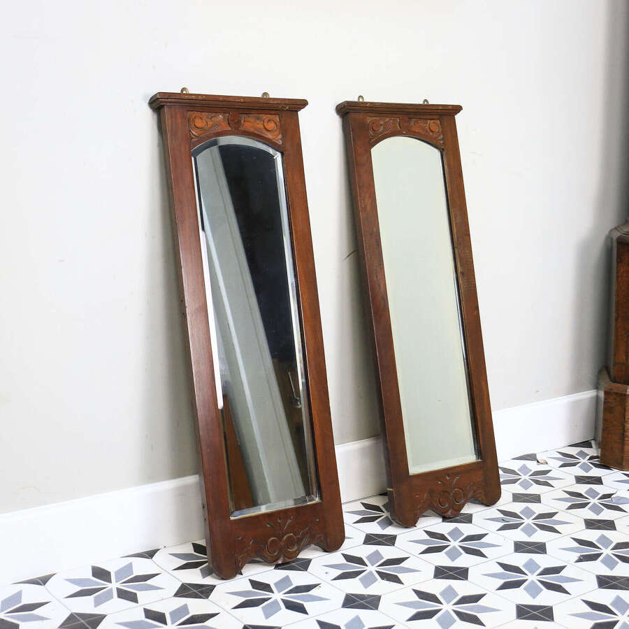 A Pair of Victorian Wall Mirrors Bevel Edged Glass Carved Top and Bottom